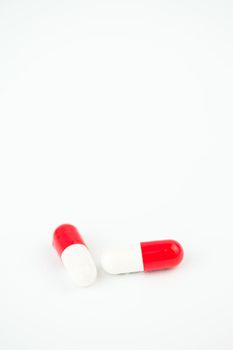 Two capsules against white background