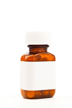 Glass bottle of medications against white background