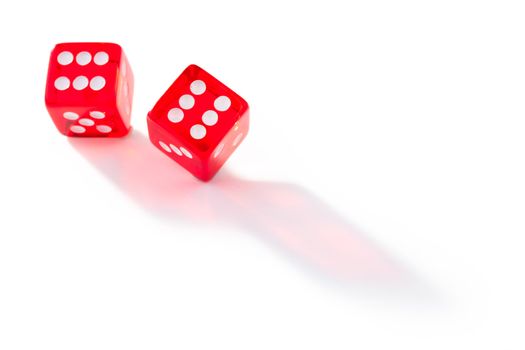 Two dices in motion against a white background