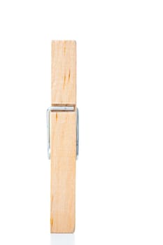 Wooden clothespin against a white background