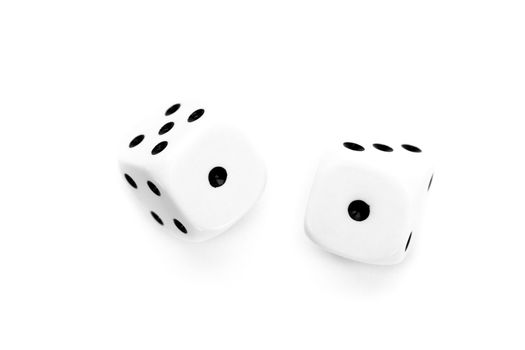 Two black and white dices thrown against a white background