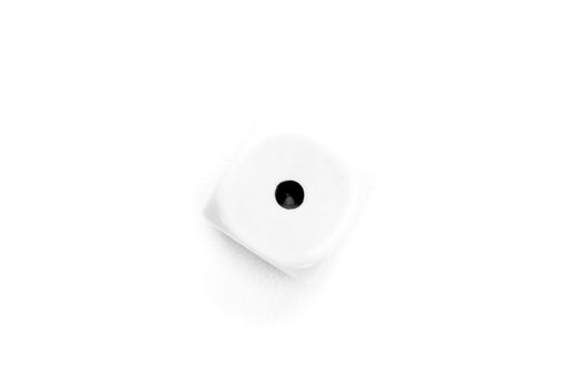 Black and white dice designating number one against a white background