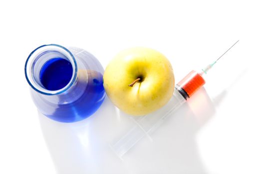 Apple beaker and a syringe against a white background