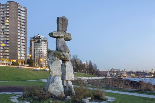 Inukshuk Stone Sculpture on Sunset Beach Alond English Bay in Vancouver BC Canada