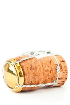 Close up of a cork with iron wire against a white background