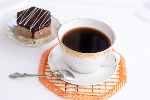 Black morning coffee and fresh sweet chocolate cake