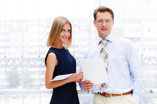 Portrait of young male and female entrepreneurs working together