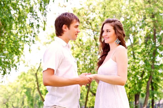 couple holding hands in the park, spending time with loved ones