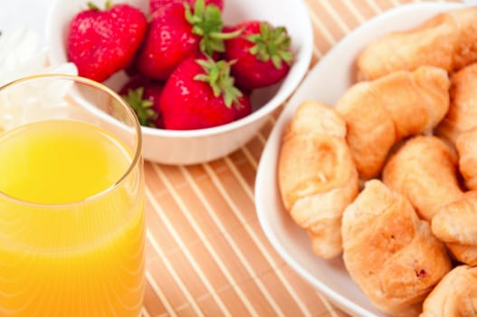 Breakfast with berries,orange juice and croissant, early breakfast