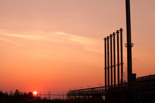 Factory chimneys at sunrise