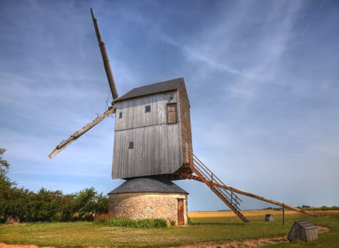 Traditional wooden windmill in France in the Eure &Loir Valley region.This is "moulin Barbier" mill.