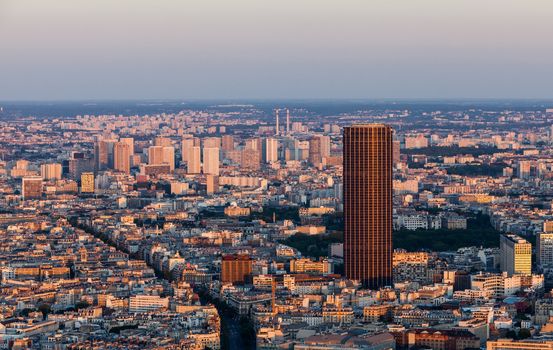Aerial view of Paris in a late spring afternoon with Montaparnasse Tower and highrises district La Grenelle in the distance.