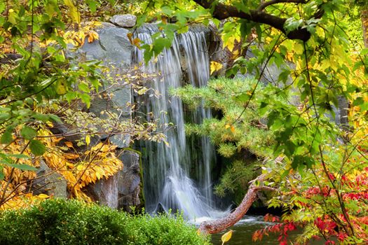 An Waterall in Autumn with Foliage in Foreground