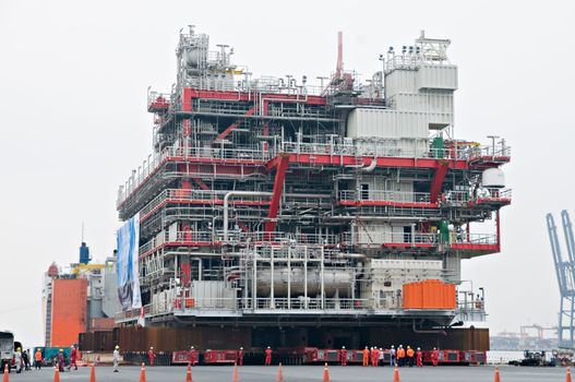 LAEM CHABANG - OCTOBER 2: A 6,000 ton module built by Aibel in Thailand for Statoil and the Gudrun Drilling Platform in the North Sea, being loaded in Laem Chabang, Thailand on October 2, 2012.