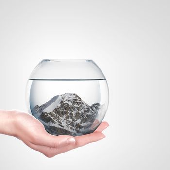 Beautiful snow-capped mountains inside a glass bowl