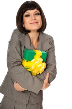 Woman holding a green box with yellow bow as a present