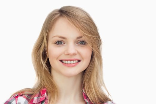 Close up of a woman smiling against a white background