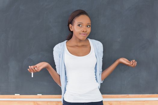 Black woman hesitating in a classroom