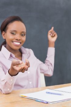 Focus on the hand on a teacher in a classroom