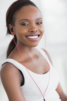 Close up of a black woman listening music in a living room
