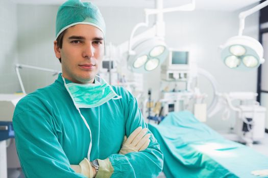 Surgeon with arms crossed in an operating theatre