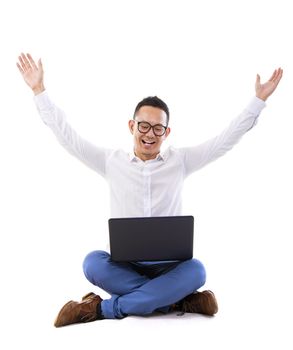 Full length of Asian businessman with hands raise looking at laptop over white background
