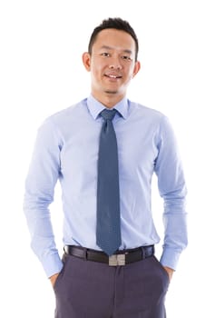 Handsome Asian businessman hand in pocket standing over white background.
