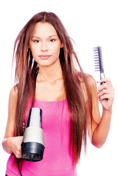 woman with long hair holding blow dryer and comb, isolated on white