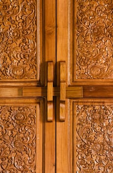 Antique closed bolt on wooden flowered door 