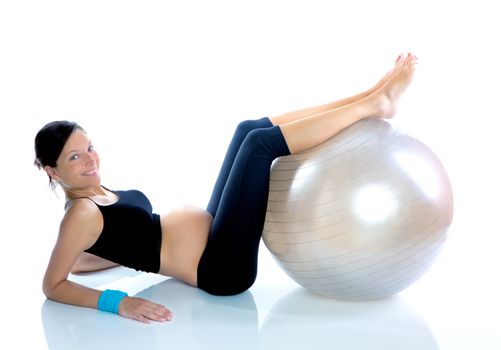Beautiful pregnant woman at fitness gym with on aerobics ball