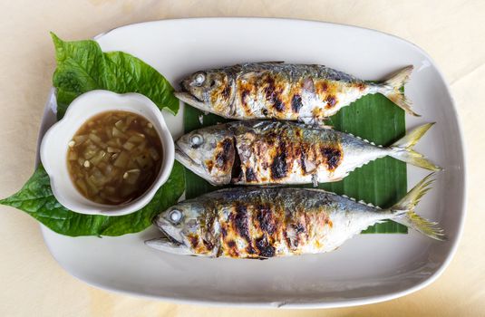 Grilled scomber fish with special fish sauce.