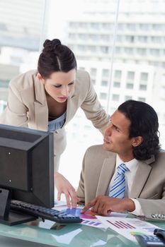 Portrait of a business team studying statistics in a meeting room