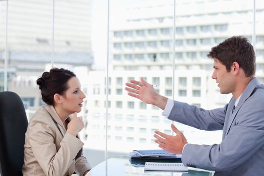 Serious business team negotiating in a meeting room