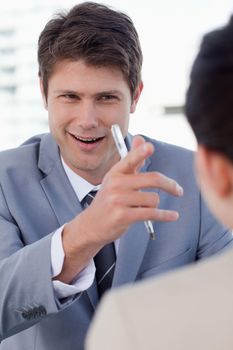 Portrait of a happy manager interviewing a female applicant in his office