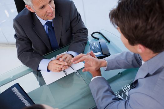 Above view of a businessmen during a meeting in an office