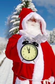 Santa Claus, Father Christmas holds watch clock