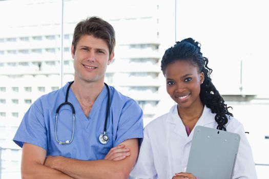 Happy doctors posing in an office