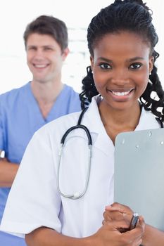 Portrait of doctors standing up in an office