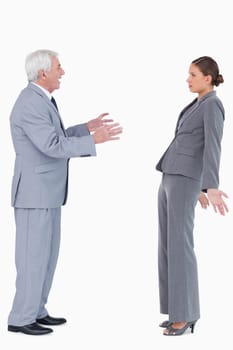 Businessman accusing colleague against a white background