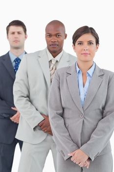 Young salesteam standing together against a white background