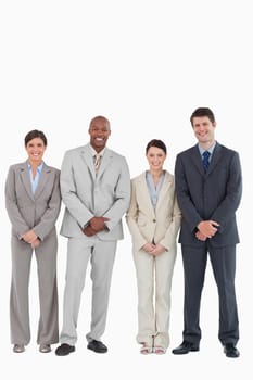 Smiling young businessteam standing together against a white background