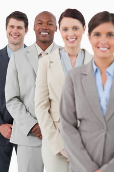 Confident smiling salesteam standing together against a white background