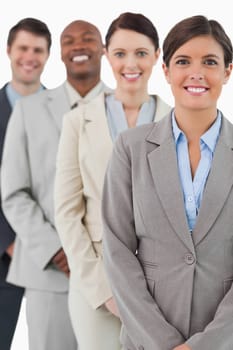 Cheerful smiling businessteam standing together against a white background