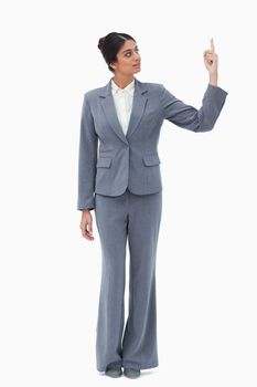 Saleswoman pointing up against a white background
