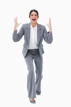 Angry yelling businesswoman against a white background