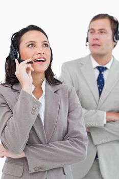 Call center agents at work against a white background