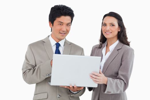 Salesteam with their laptop against a white background