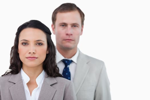 Office employees standing together against a white background