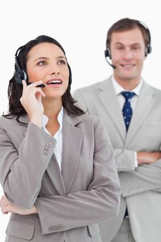 Call center agents standing together against a white background