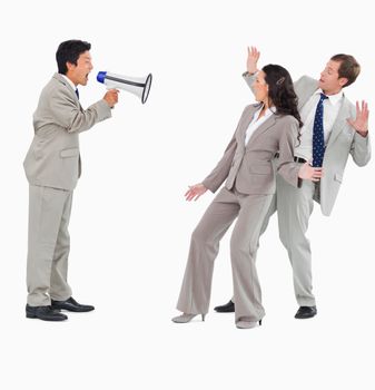 Salesman with megaphone shouting at colleagues against a white background